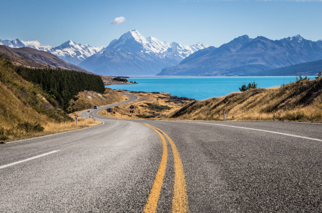 Winding road leading to Mt Cook along lake Pukaki in New Zealand